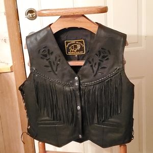 Milwaukee leather fringed vest with rose's on it.
